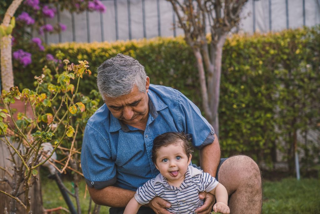 Man with baby in the garden