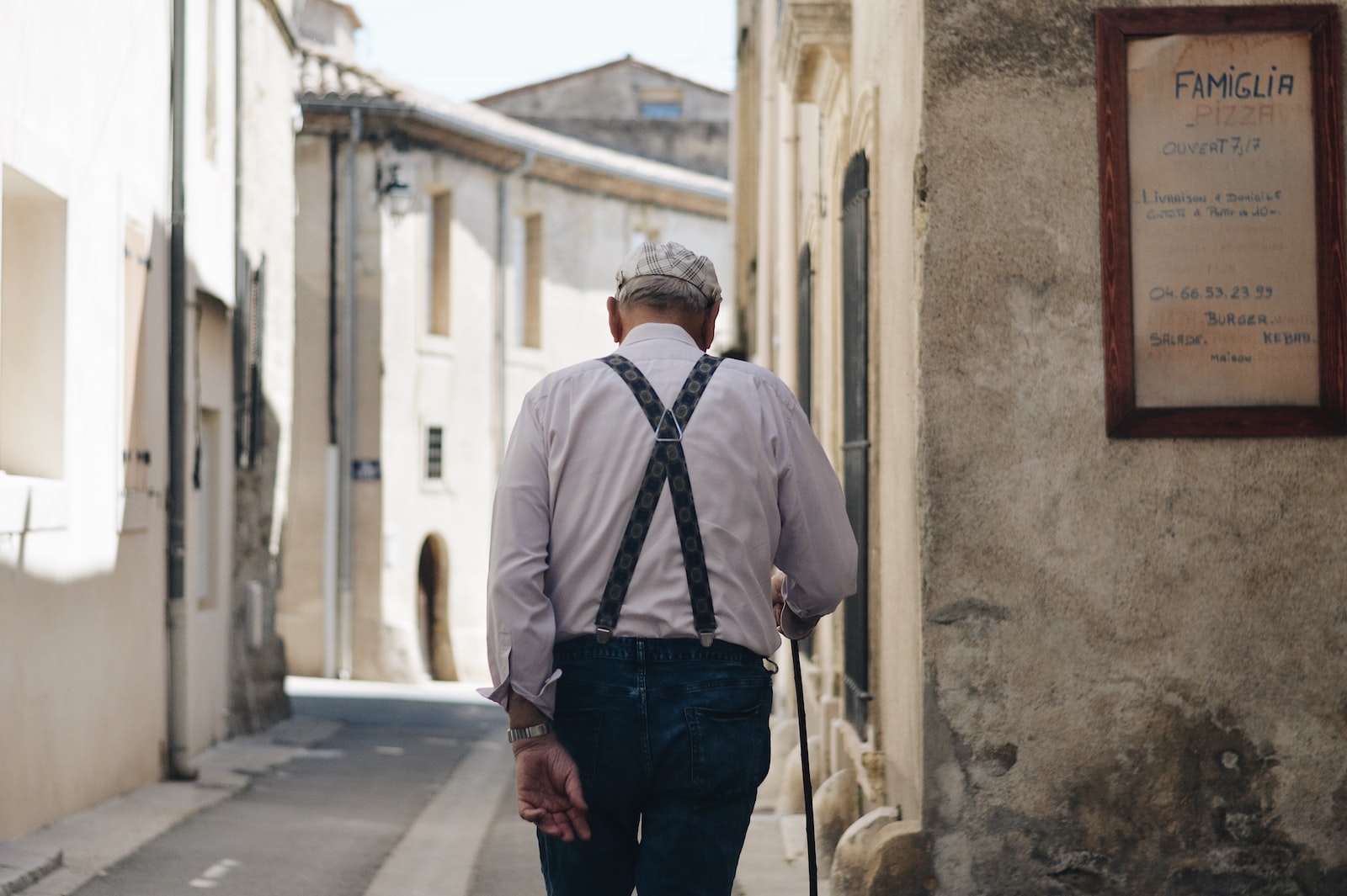 Man walking around a narrow street